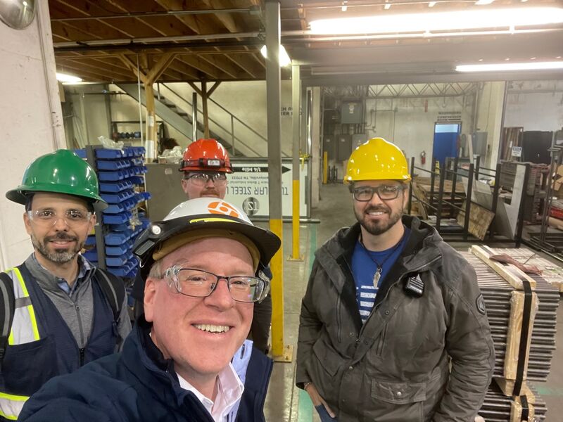 David Jones with Tubular Steel team members on the factory floor